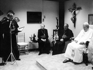 Archbishop Renato Martino offering Pope John Paul II words of welcome before His Holiness blesses the newly-acquired building